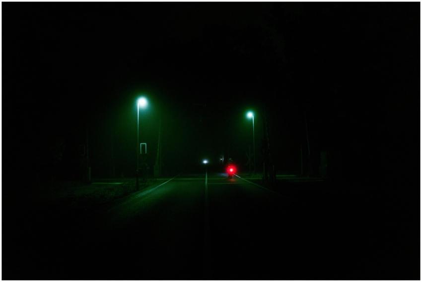 Moody Berlin street scene at night with illuminate