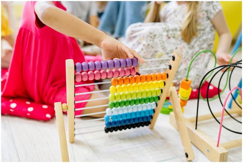 Children actively learning with a colorful abacus