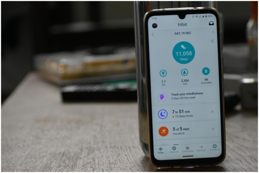 Close-up of a smartphone displaying a fitness trac