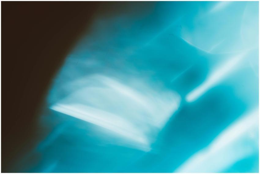 Abstract image featuring blue and white blurred sh