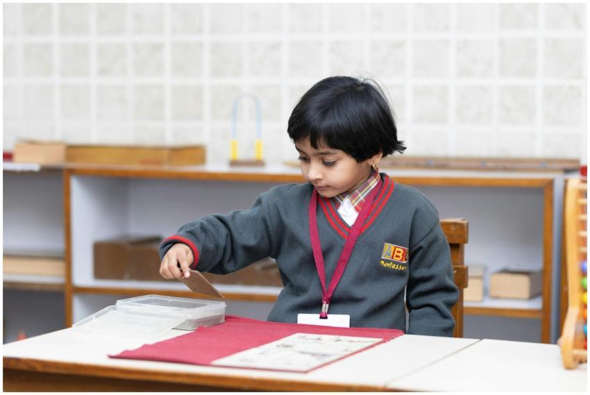 Child engaged in learning activity at a Montessori