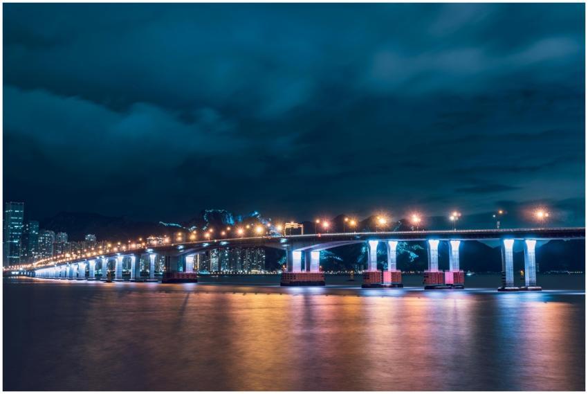 Stunning night view of a bridge lit with city ligh
