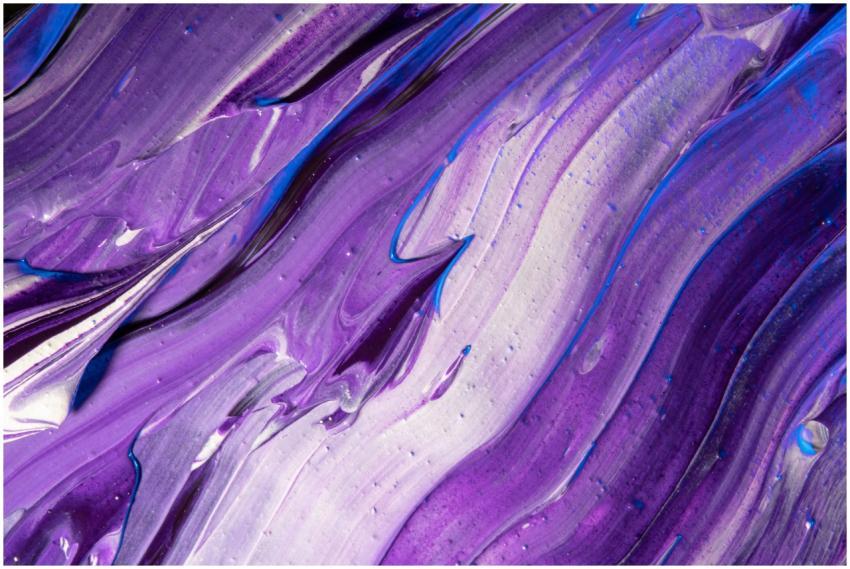 A close-up of vibrant violet and blue abstract pai