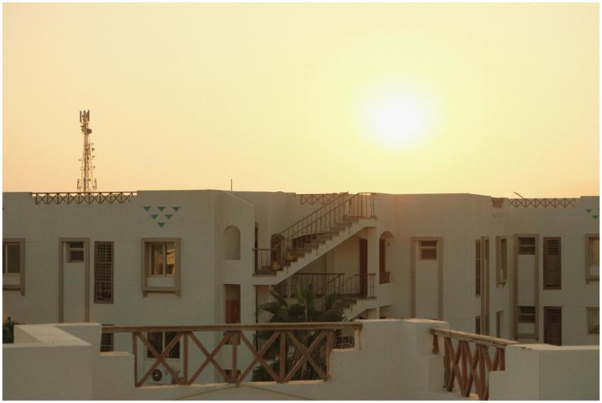 Serene sunset view over a modern apartment complex