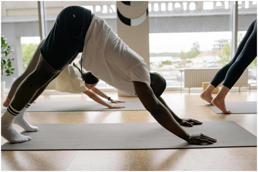 Diverse group of people performing yoga in a studi