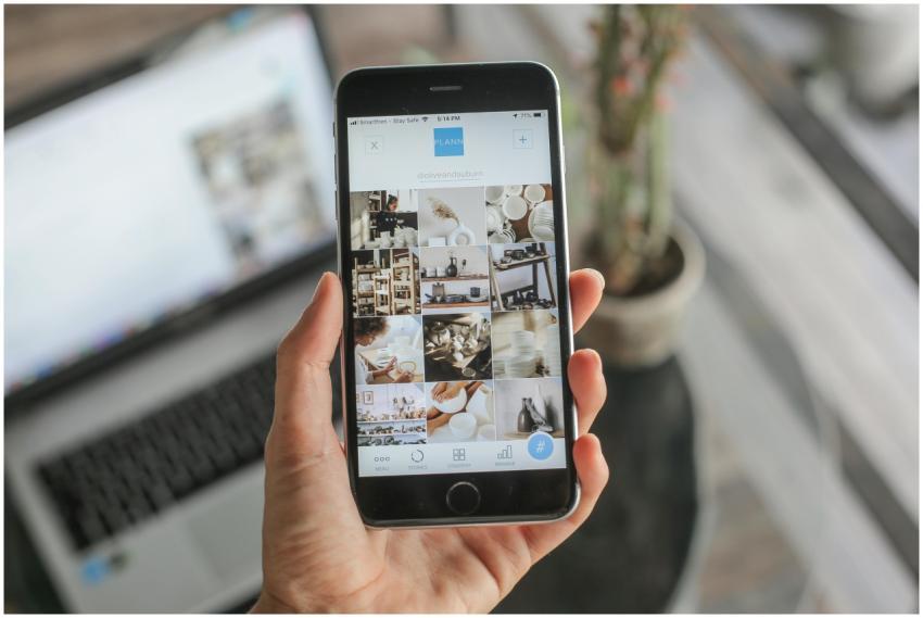 Close-up of a woman using a social media app on a