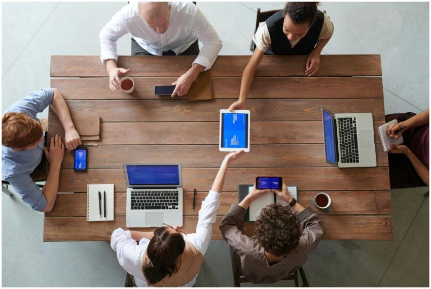 A diverse group of professionals engaged in a prod