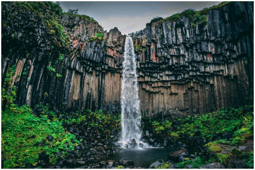 Captivating waterfall cascading over unique basalt