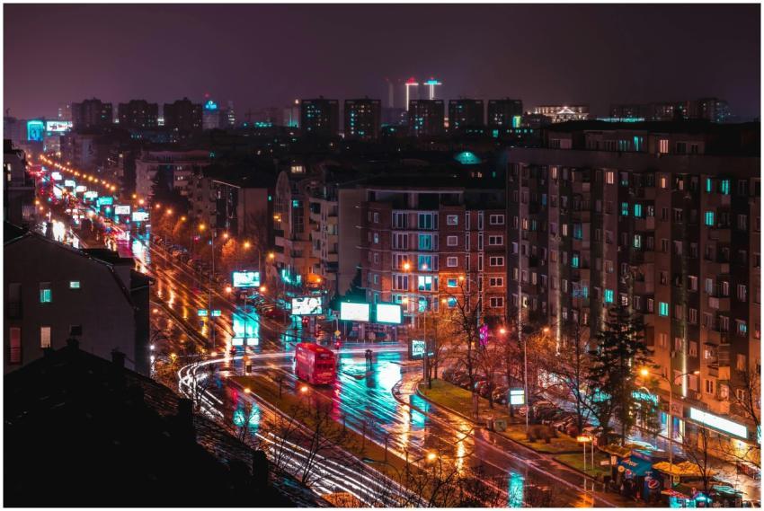 A vibrant aerial view of Skopje's city lights refl