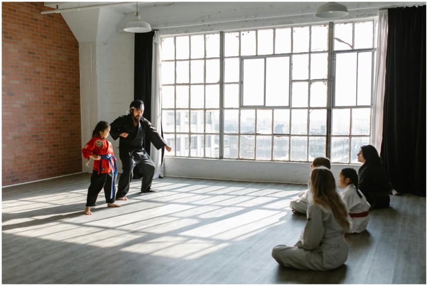 Children and instructor practicing martial arts in