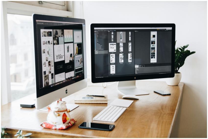 A well-organized design workspace with dual monito