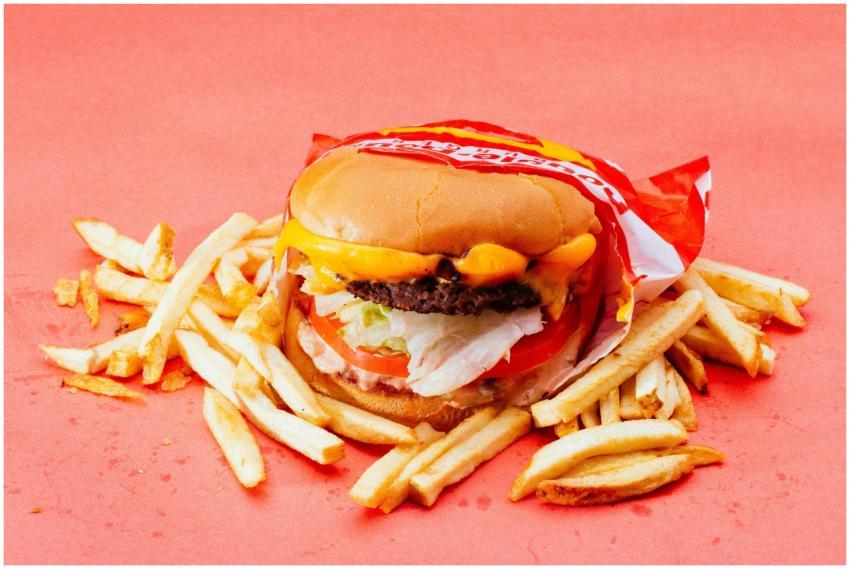 Tasty cheeseburger with fresh ingredients and fren