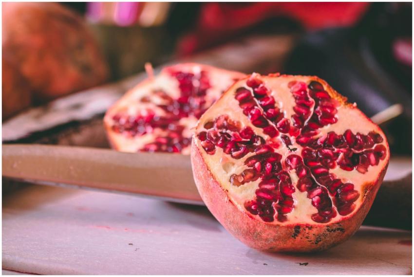 Vibrant pomegranate halves showcasing juicy seeds