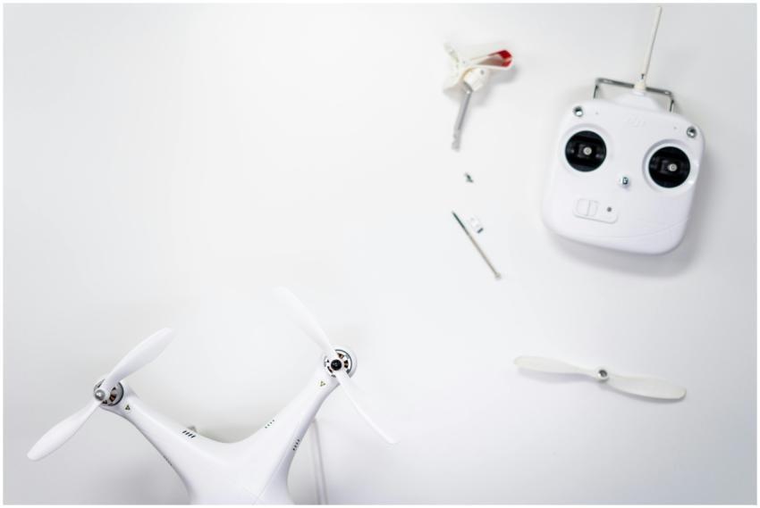 A flat lay of a drone kit including a controller a