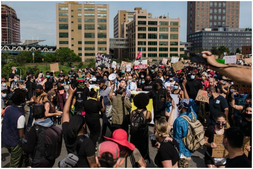 A large and diverse crowd gathers for a peaceful p