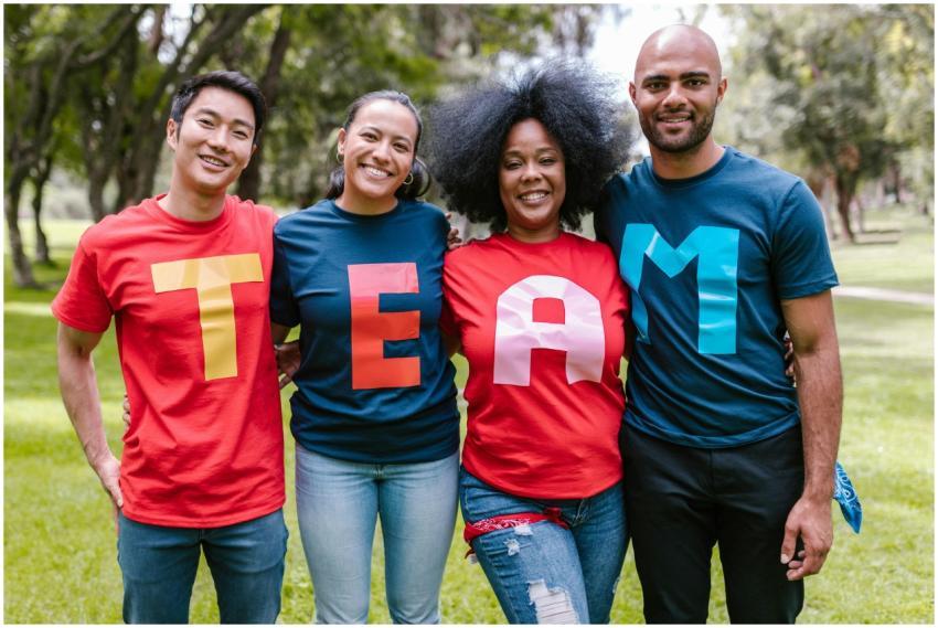 A diverse group of adults bonding and smiling in a