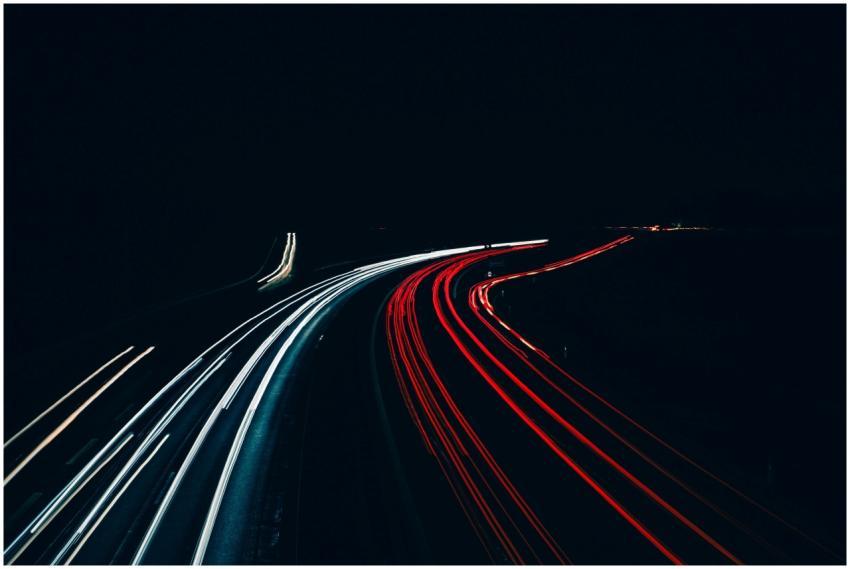 Long exposure shot capturing light trails of vehic