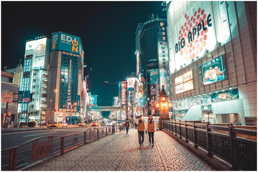 Urban Japan cityscape at night with illuminated bu