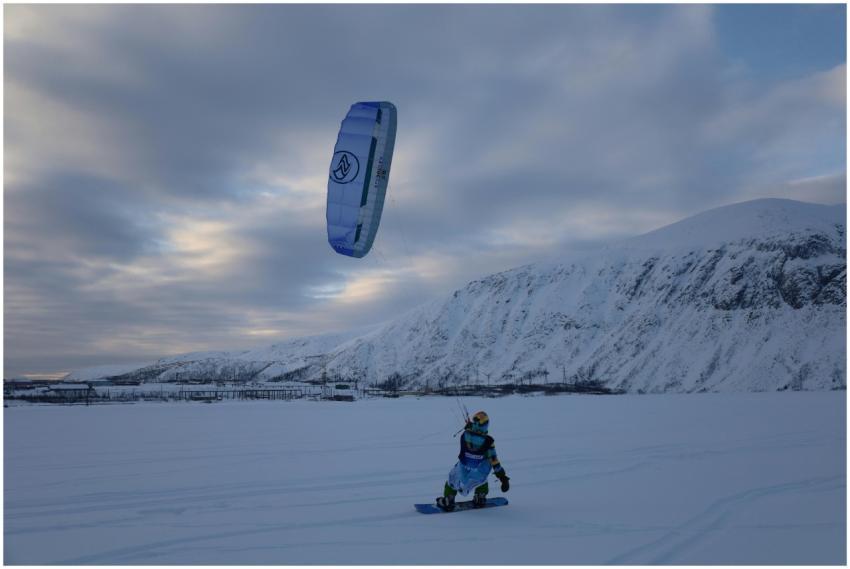 Person snowkiting in Kirovsk, Russia, with snow-co
