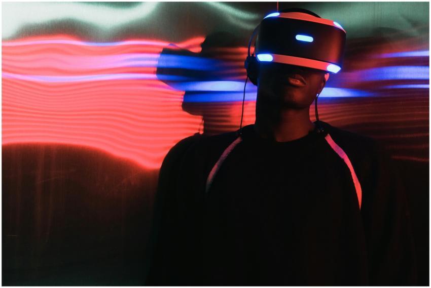 A person wearing virtual reality headset surrounde