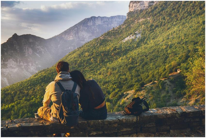 Couple sitting together enjoying a scenic mountain