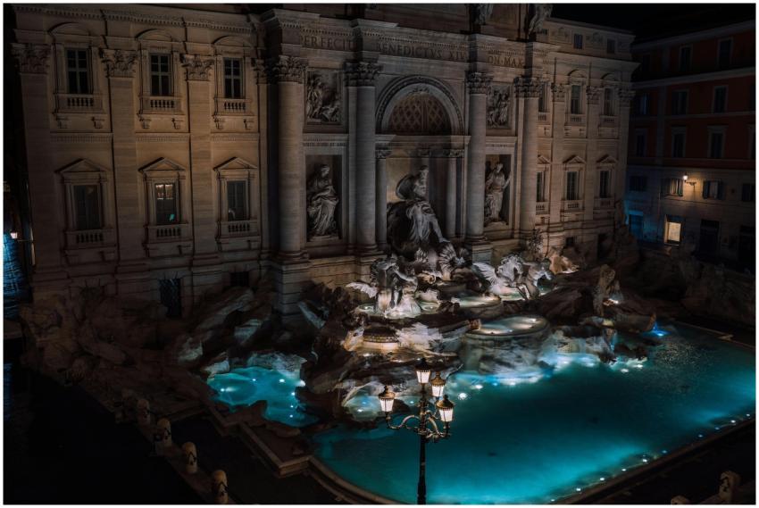 A stunning nighttime view of the illuminated Trevi