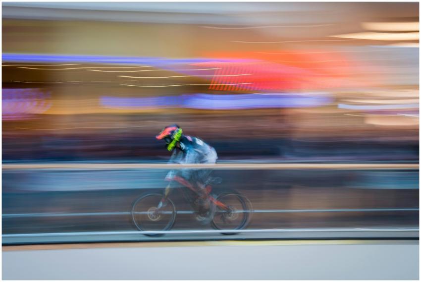 Blurred motion image of a cyclist speeding through