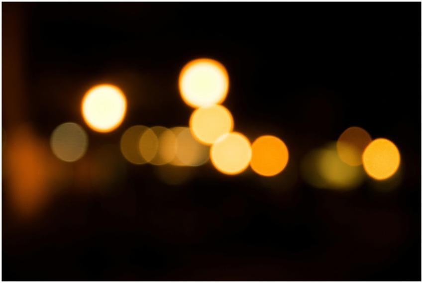 Blurred golden bokeh lights create a warm festive