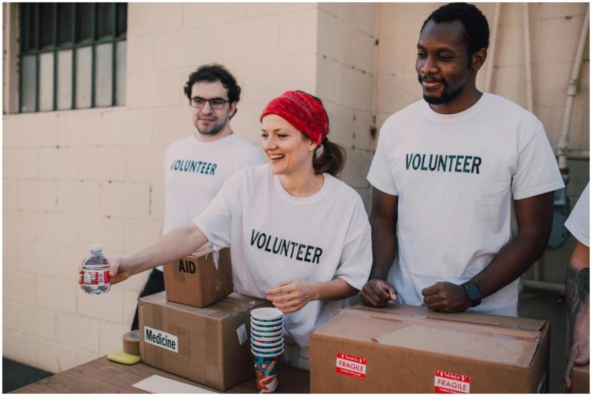 Volunteers distributing aid at an outdoor donation