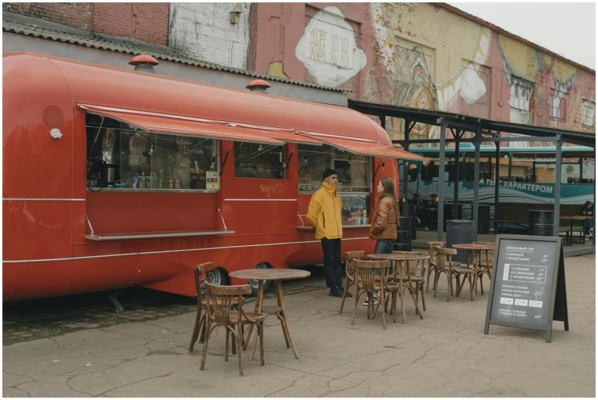 Street food truck with customers enjoying urban al