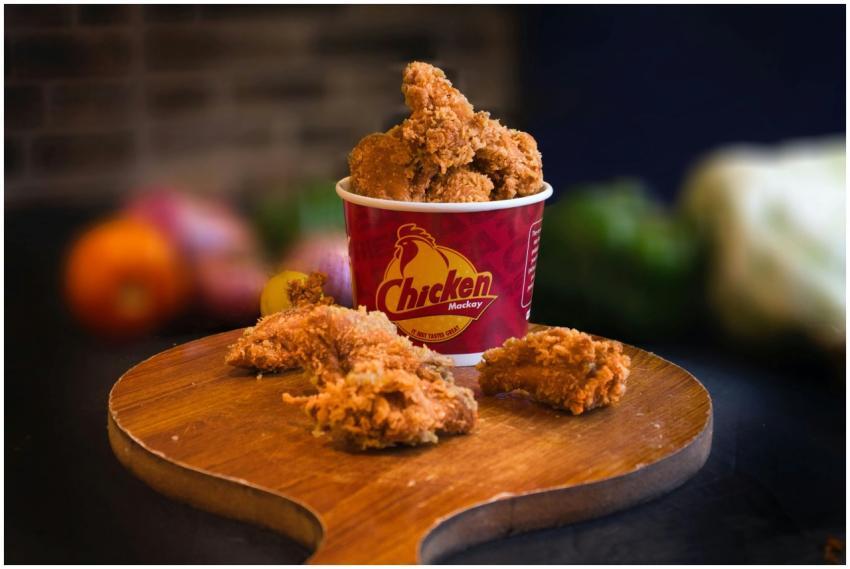 Mouth-watering fried chicken in a bucket displayed