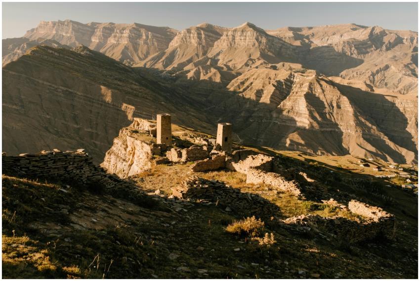 Explore rugged mountain ruins drenched in warm, go