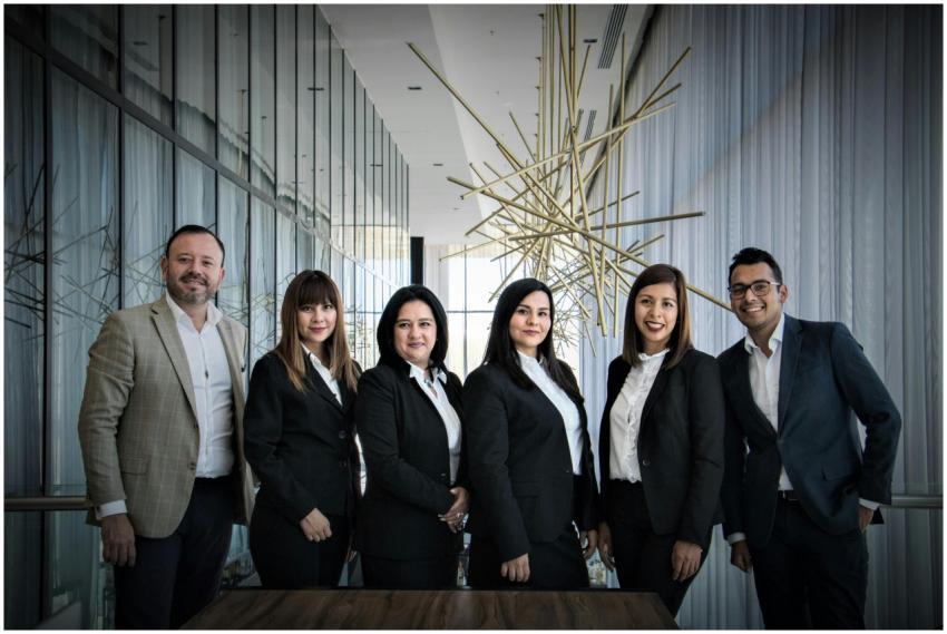Diverse business team in formal attire posed in mo