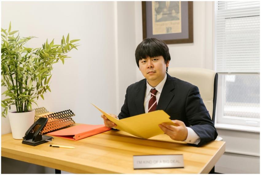 Asian businessman holding a folder in a modern off
