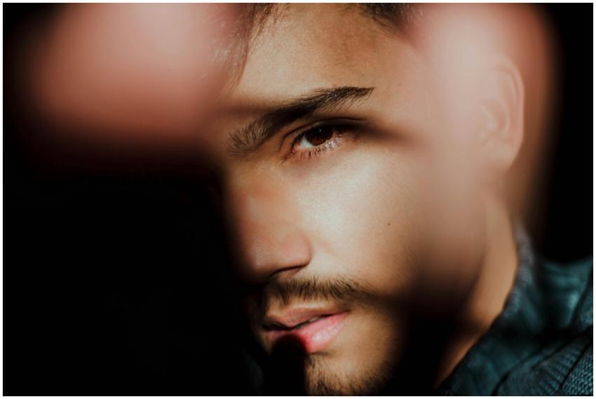 Stylized close-up of a man's face with striking li