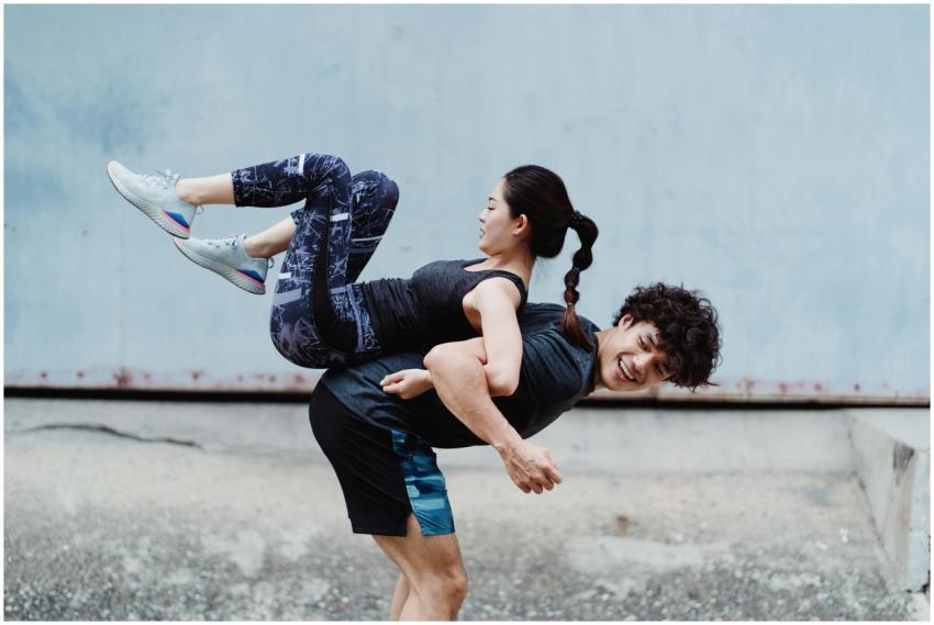 Energetic couple having fun with playful exercises