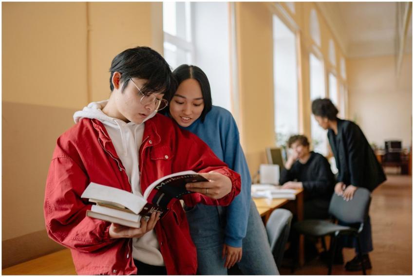 Group of students reading and studying together in