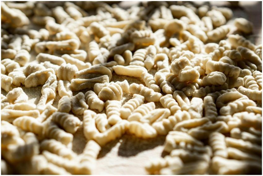 Detailed view of freshly made pasta drying in warm