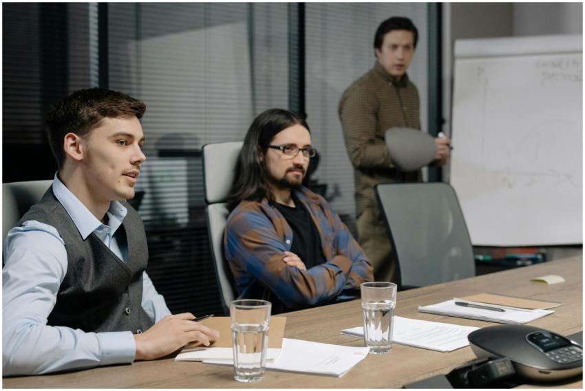 Colleagues discussing ideas in a modern office mee