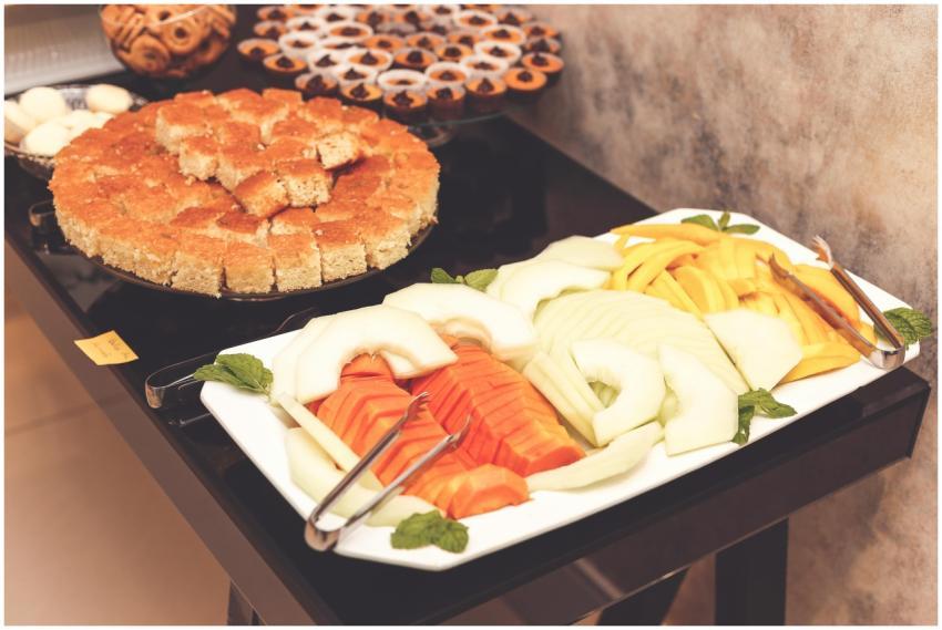 A vibrant and delicious buffet with cut fruit and