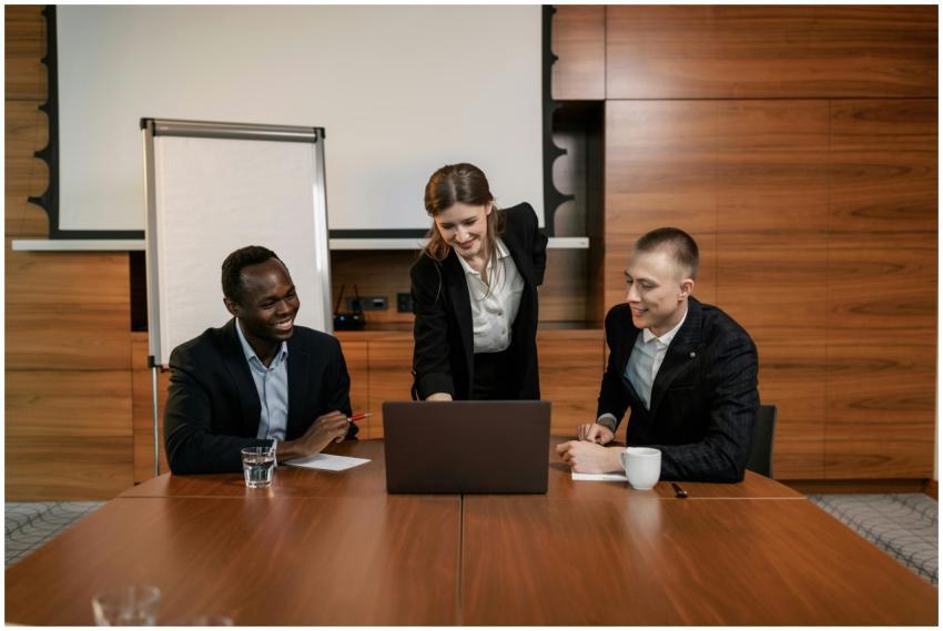 Three business professionals collaborating on a pr