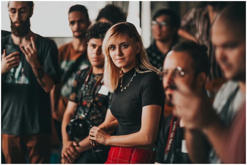 A diverse group of young adults gathered in a crea