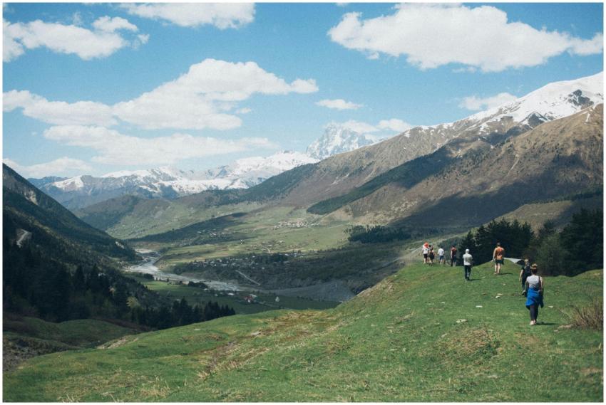 Group of hikers enjoying the stunning mountain lan