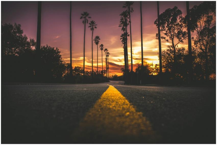 A captivating sunset view of an empty highway line