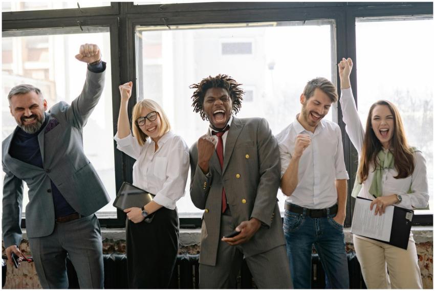 A joyful, diverse group of colleagues celebrating