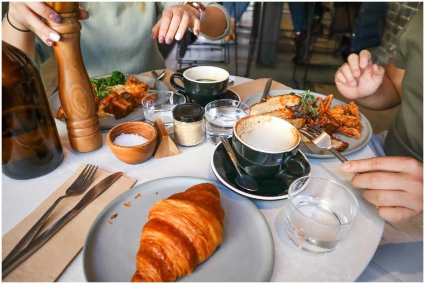 Casual brunch scene with croissants and coffee, id