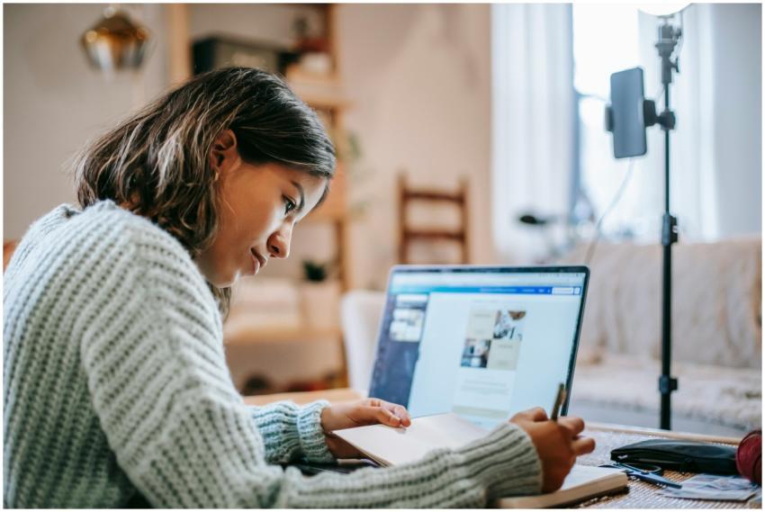 Side view of concentrated young Latin American fem