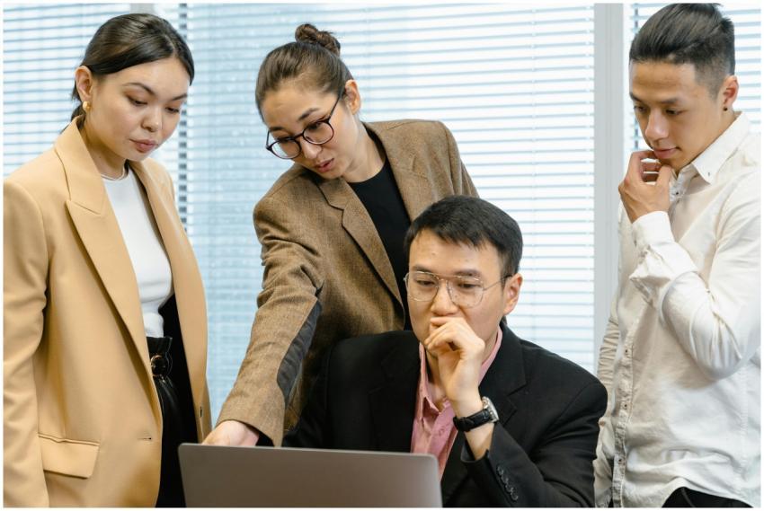 A group of focused professionals collaborating aro