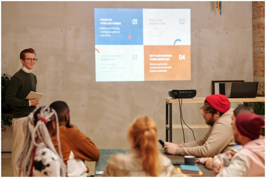 Team engaged in a business presentation with a foc