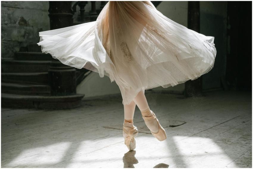 Close-up of a ballerina in pointe shoes, elegantly